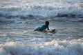 Kovalam, Chennai, Tamilnadu, India - Ã¢â¬Å½Ã¢â¬Å½August 9th Ã¢â¬Å½2021: Young boy Indian surfer surfing and practicing on the beach waves Royalty Free Stock Photo
